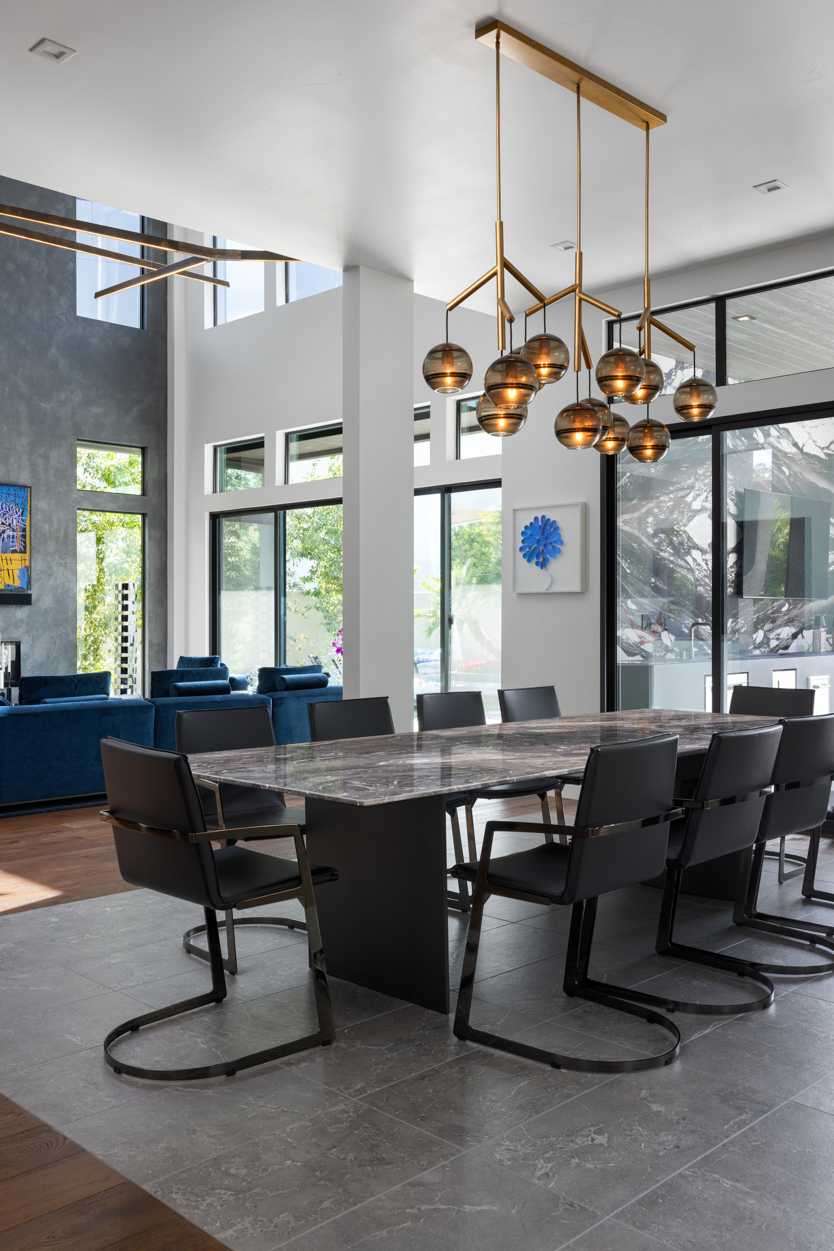 Dining room with smoked-glass globe chandelier and marble table